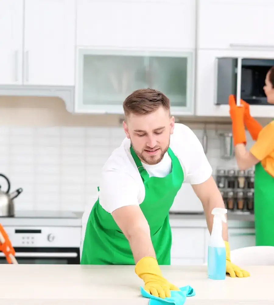 Maubell team wiping down a kitchen counter